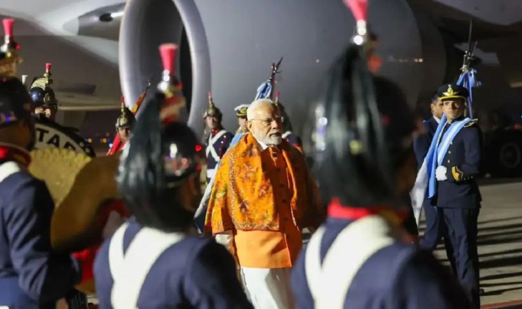 Prime Minister Narendra Modi receives ceremonial welcome in Buenos Aires, Argentina, during his two-day diplomatic visit as guards in traditional attire stand in formation.