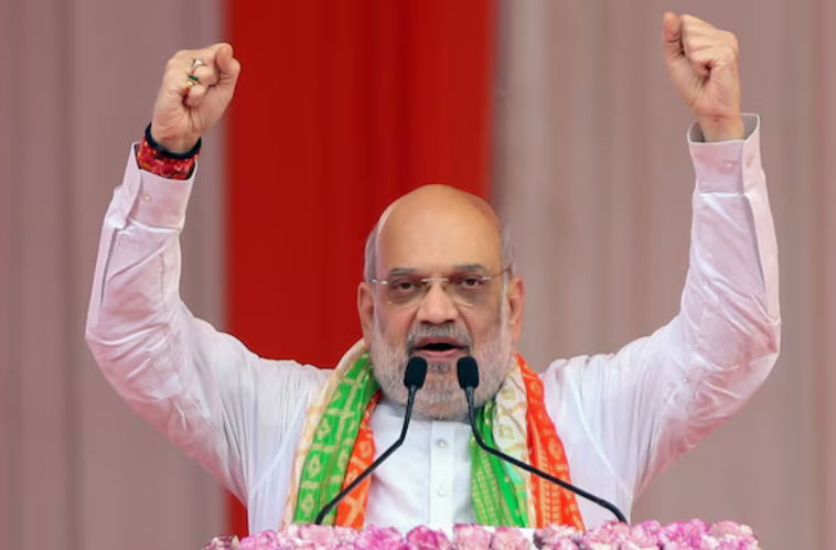 Union Home Minister Amit Shah raises both fists while addressing the Lok Sabha on Operation Sindoor during the Parliament Monsoon Session 2025